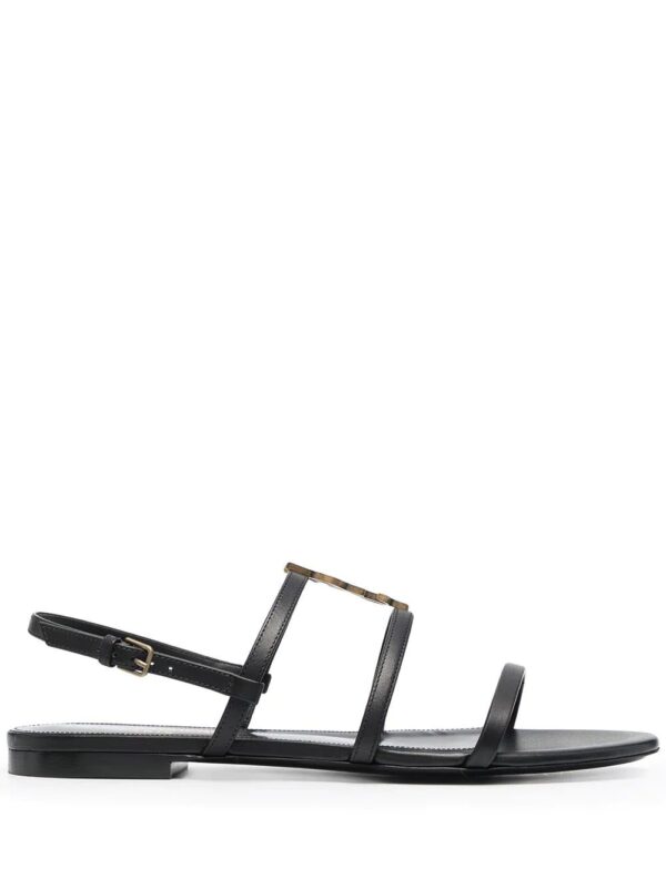 Saint Laurent Cassandra monogram flat sandals.
