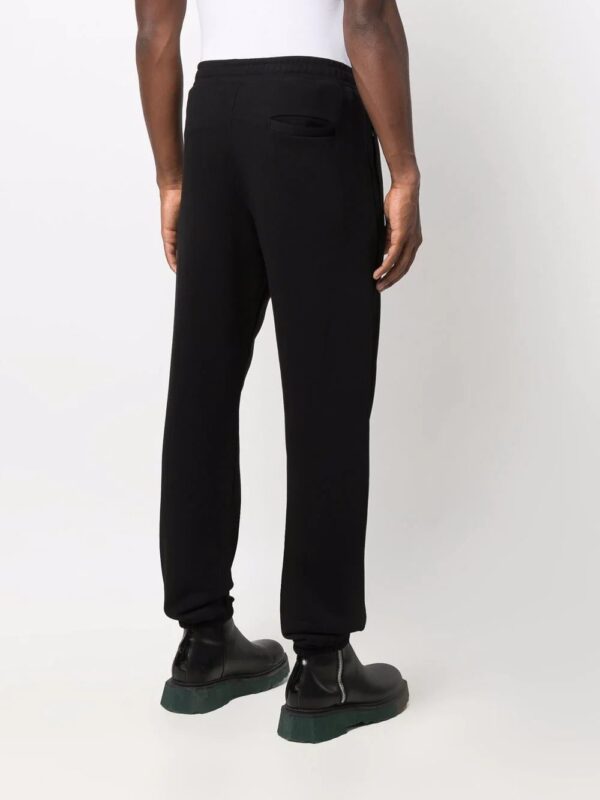 Moschino  logo-print track pants - Image 4