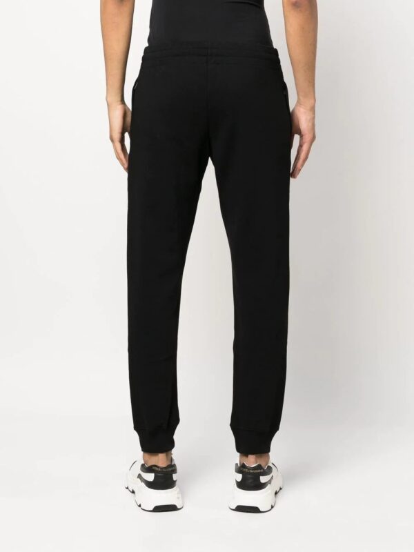 Moschino  logo-print track pants - Image 4