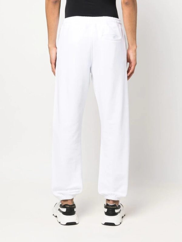 Moschino  logo-print track pants - Image 4