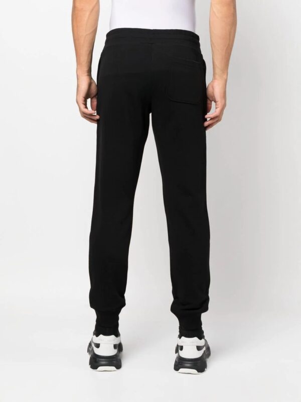 Moschino  logo-print track pants - Image 4