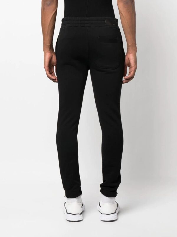 AMIRI  logo-embroidered track pants - Image 4